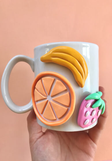 Mugs decorated with polymer clay